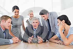 Businessman forecasting the future with his crystal ball