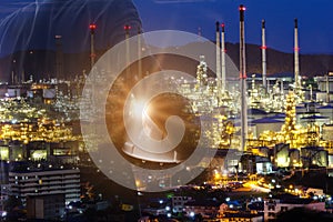 Businessman Foreman working with night oil refinery industry plant and double exposure. Factory in the night as communication of