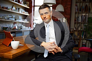 Businessman in formal cloths drinking coffee