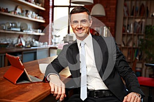 Businessman in formal cloths drinking coffee