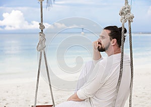 Businessman freelance on beach dreaming. Sand beach