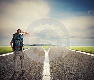 Businessman in front of a crossway must select the right way