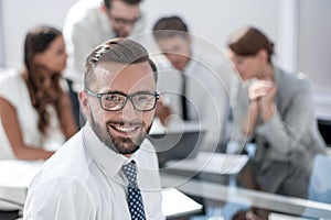 Businessman in front of his business team