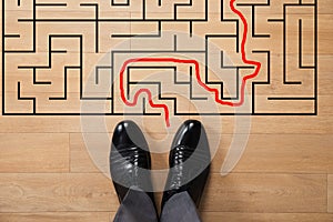 Businessman In Front Of Labyrinth