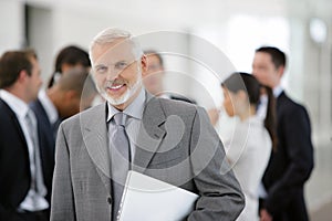 Businessman in front of sales team