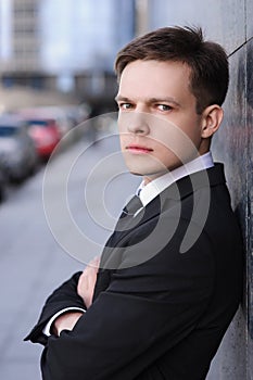 Businessman frowned and leaned back against the