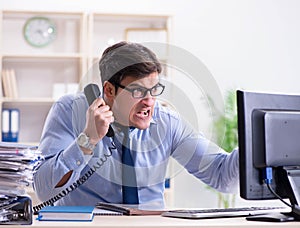 Businessman frustrated at many telephone calls