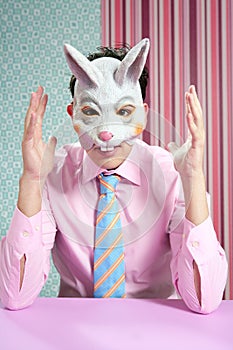 Businessman with funny rabbit mask