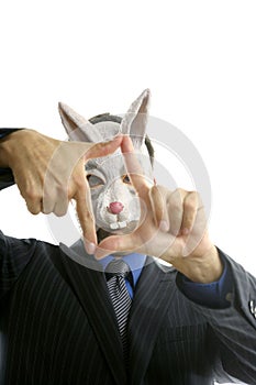 Businessman with funny rabbit mask