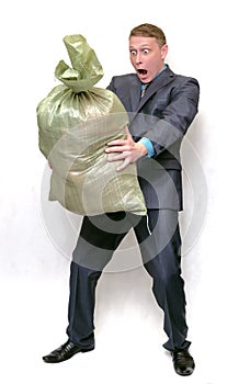 Businessman with garbage trash bag.
