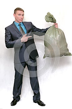 Businessman with garbage trash bag.