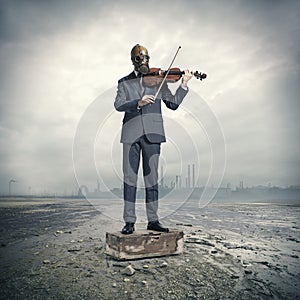 Businessman with gas mask, plays the violin