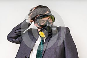 Businessman with gas mask on white