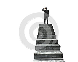 Businessman gazing on top of concrete stairs