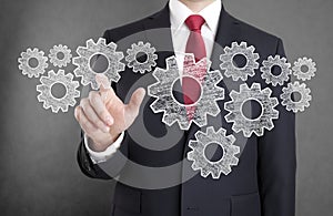 Businessman with gears