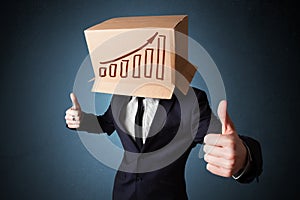 Businessman gesturing with a cardboard box on his head with diagram