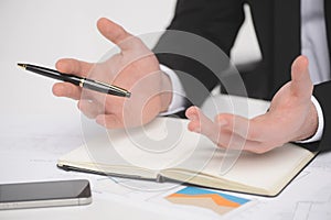 Businessman gesturing. Close-up of businessman gesturing with a