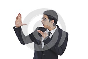 Businessman gesturing and l