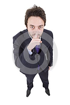 Businessman gesturing silent sign