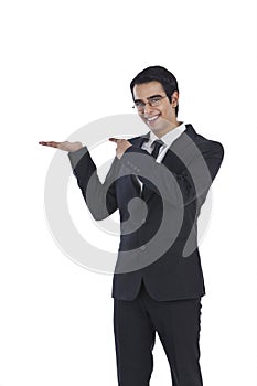 Businessman gesturing and smiling