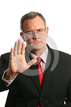 Businessman in gesturing for someone to stop