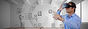 Composite image of businessman gesturing while using virtual reality simulator