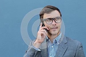 Businessman getting shocking news on the phone
