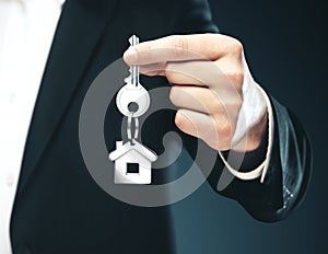 Businessman gives keys to house