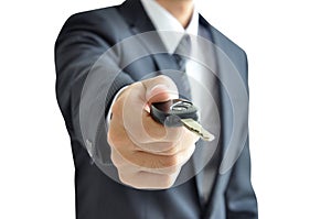 Businessman giving a car key - car sale & rental concept