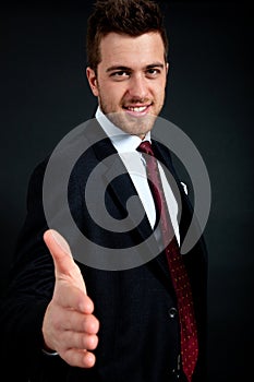 Businessman giving hand