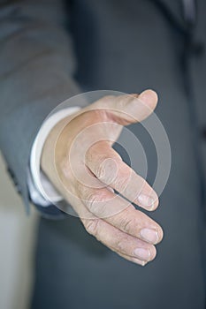 Businessman giving hand