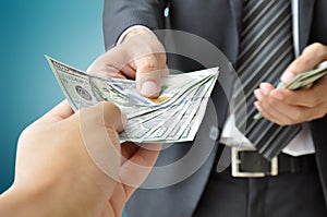 Businessman giving money - United States dollar (USD)