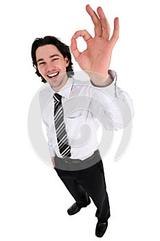 Businessman giving OK gesture