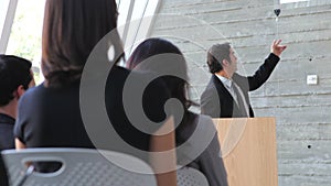 Businessman Giving Presentation At Conference