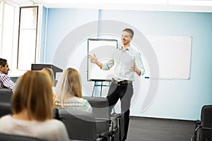 Businessman giving a presentation on flipchart.