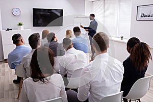 Businessman Giving Presentation To His Colleagues