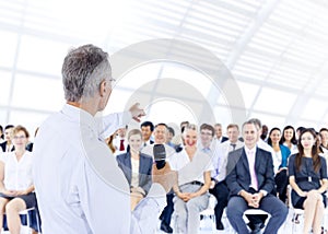 Businessman giving presentation to his Colleagues