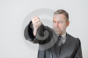 Businessman giving a thumbs down gesture