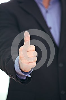 Businessman giving a thumbs up