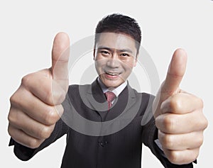 Businessman Giving Thumbs-Up