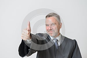 Businessman giving a thumbs up gesture