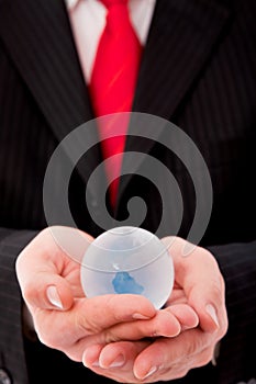 Businessman with a glass globe