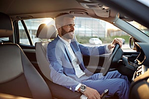 Businessman going on business trip by car