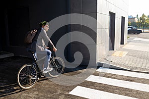 Businessman going to work on bike. Eco friendly transport.