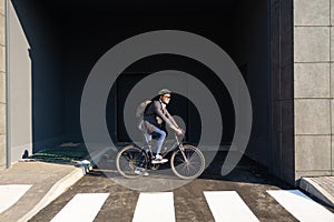 Businessman going to work on bike. Eco friendly transport.