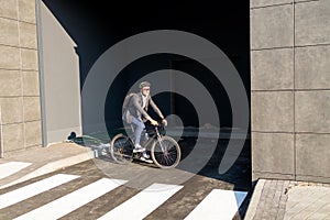 Businessman going to work on bike. Eco friendly transport.