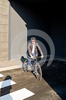 Businessman going to work on bike. Eco friendly transport.