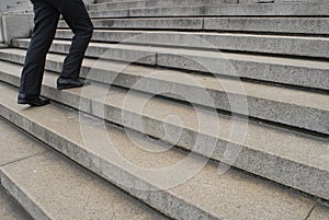 Businessman going up stairs