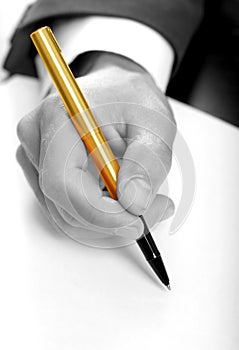 Businessman with gold pen