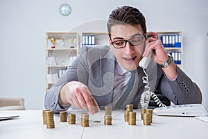 The businessman with golden coins in business growth concept